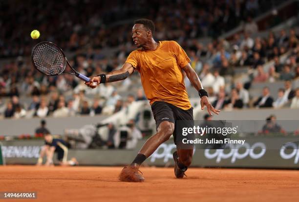 Gael Monfils of France plays a backhand against Sebastian Baez of Argentina during their Men's Singles First Round Match on Day Three of the 2023...