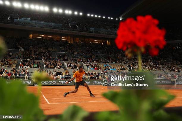 Gael Monfils of France plays a forehand against Sebastian Baez of Argentina during their Men's Singles First Round Match on Day Three of the 2023...