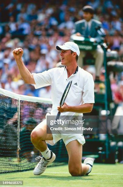 Marat Safin of Russia in action against Goran Ivanisevic of Croatia during the Mens Singles Championship at The Wimbledon Lawn Tennis Championship at...