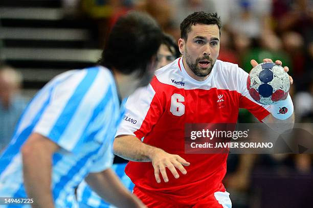 Iceland's rightwing Asgeir Orn Hallgrimsson runs with the ball during the men's preliminaries Group A handball match Iceland vs Argentina for the...