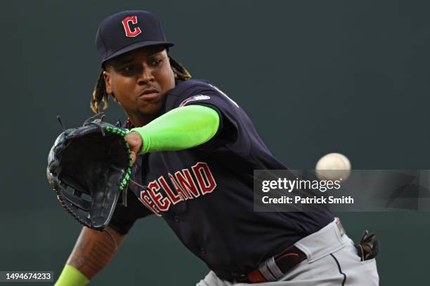Jose Ramirez of the Cleveland Guardians tries to make a play on a hit against the Baltimore Orioles during the third inning at Oriole Park at Camden...