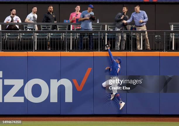 Brandon Nimmo of the New York Mets catches a hit by Nick Castellanos of the Philadelphia Phillies in the fourth inning at Citi Field on May 30, 2023...