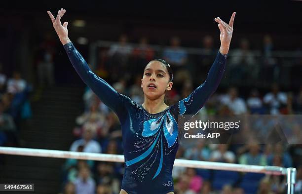 Guatemala's gymnast Ana Sofia Gomez Porras performs on the uneven bars during the women's qualification of the artistic gymnastics event of the...