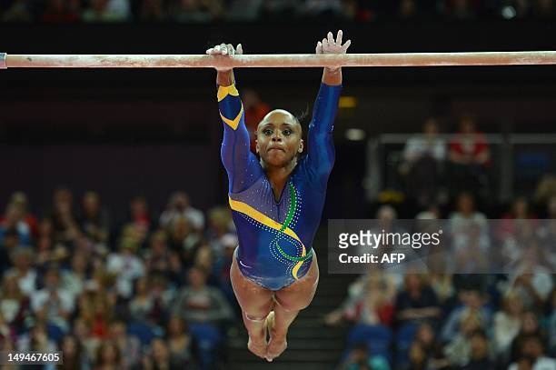 Brazil's gymnast Daiane Dos Santos performs on the uneven bars during the women's qualification of the artistic gymnastics event of the London...