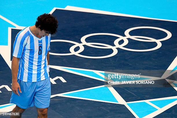 Argentina's Diego Esteban Simonet reacts after being defeated by Iceland by 31-25 at the end of the men's preliminaries Group A handball match...
