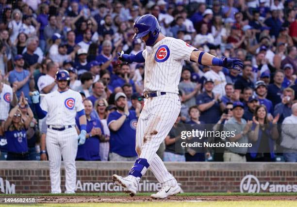 Nico Hoerner of the Chicago Cubs celebrates a home run during the first inning of a game against the Tampa Bay Rays at Wrigley Field on May 30, 2023...