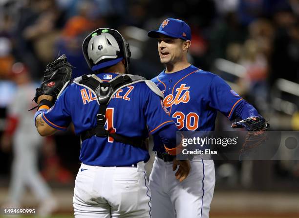 David Robertson and Francisco Alvarez of the New York Mets celebrate the winover the Philadelphia Phillies at Citi Field on May 30, 2023 in the...