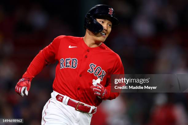 Masataka Yoshida of the Boston Red Sox rounds first base during the eighth inning against the Cincinnati Reds at Fenway Park on May 30, 2023 in...