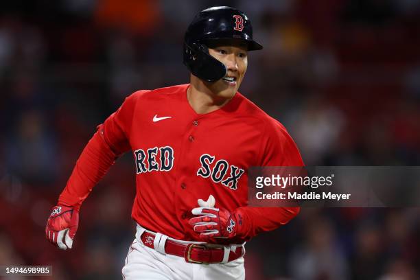 Masataka Yoshida of the Boston Red Sox rounds first base during the eighth inning against the Cincinnati Reds at Fenway Park on May 30, 2023 in...