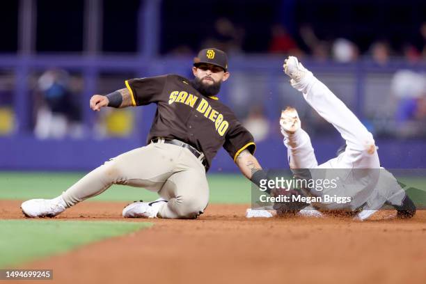 Yuli Gurriel of the Miami Marlins slides to second base against Rougned Odor of the San Diego Padres during the seventh inning at loanDepot park on...