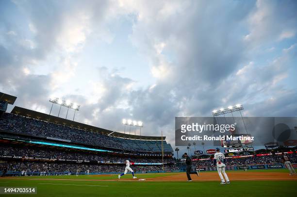 Jason Heyward of the Los Angeles Dodgers runs the bases after hitting a home run against the Washington Nationals in the second inning at Dodger...