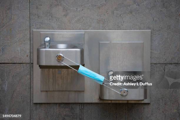 water fountains with a mask - drinking fountain stock pictures, royalty-free photos & images