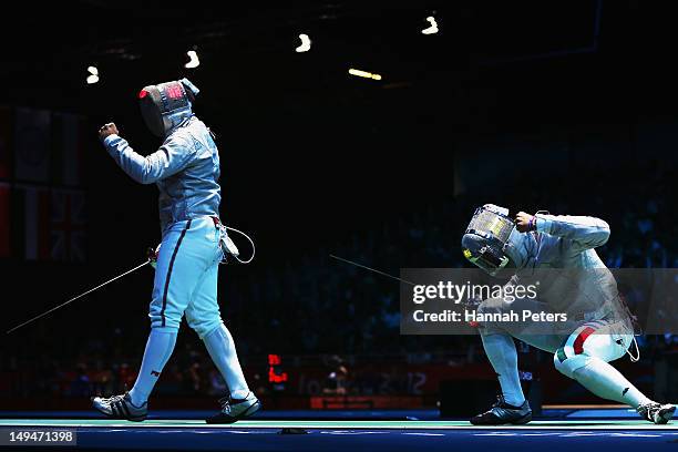 Valery Pryiemka of Bulgeria and Aldo Montano of Italy compete in the Men's Sabre Individual Fencing round of 32 match on Day 2 of the London 2012...