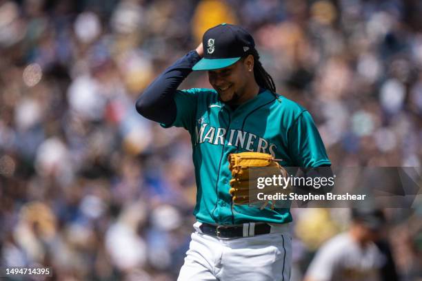 Starting pitcher Luis Castillo of the Seattle Mariners smiles as he walks off the field during a game against the Pittsburgh Pirates at T-Mobile Park...