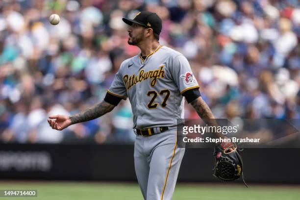 Starting pitcher Vince Velasquez of the Pittsburgh Pirates tosses the ball between pitches during a game against the Seattle Mariners at T-Mobile...