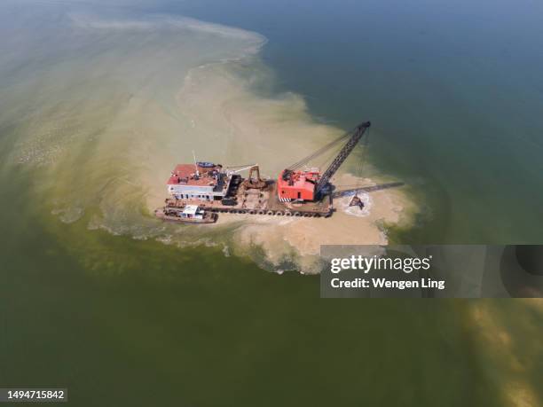 vessels clearing channel silt - dredger stock pictures, royalty-free photos & images