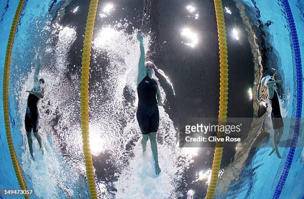 Chloe Sutton of the United States, Rebecca Adlington of Great Britain and Xuanxu Li of China compete in the Women's 400m Freestyle heat 3 on Day 2 of...