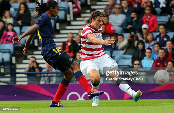 Abby Wambach of USA battles with Louisa Necib of Columbia during the Women's Football first round Group G match between United States and Colombia on...