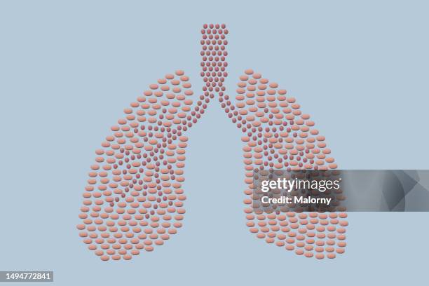 pills in the shape of a human lungs. - respiratory disease stock-fotos und bilder