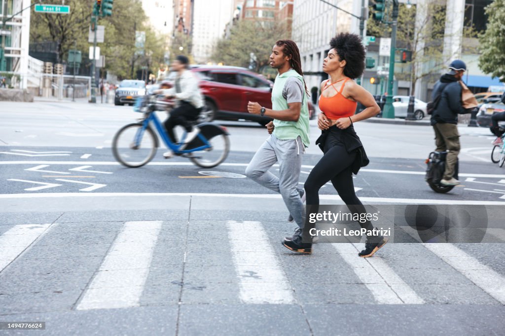 Sporty couple running outdoors