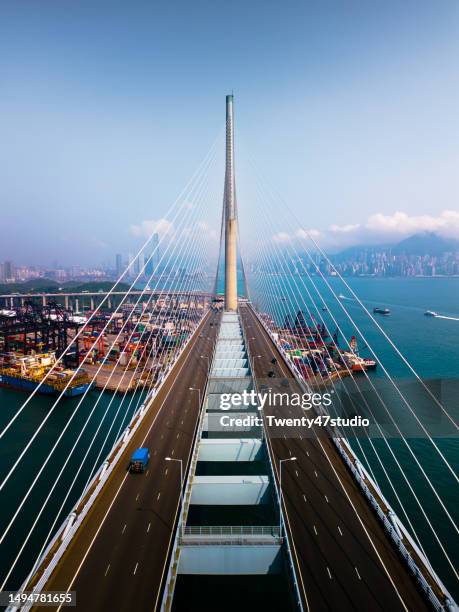 aerial view of suspension bridge in a industrial area in hong kong - docklands studio stock pictures, royalty-free photos & images