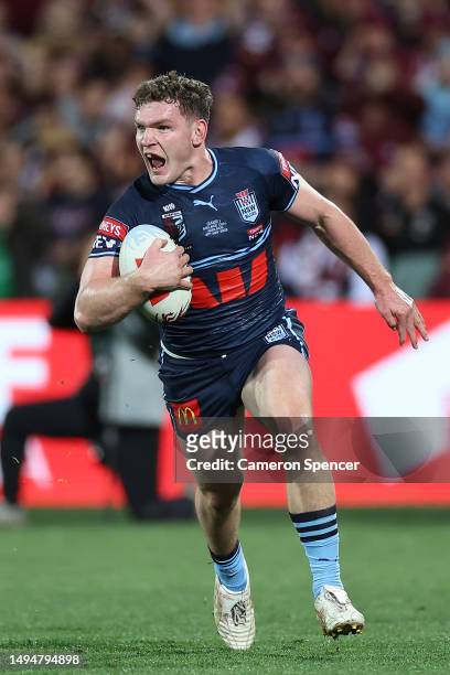 Liam Martin of the Blues scores a try during game one of the 2023 State of Origin series between the Queensland Maroons and New South Wales Blues at...