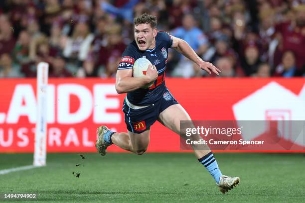 Liam Martin of the Blues scores a try during game one of the 2023 State of Origin series between the Queensland Maroons and New South Wales Blues at...