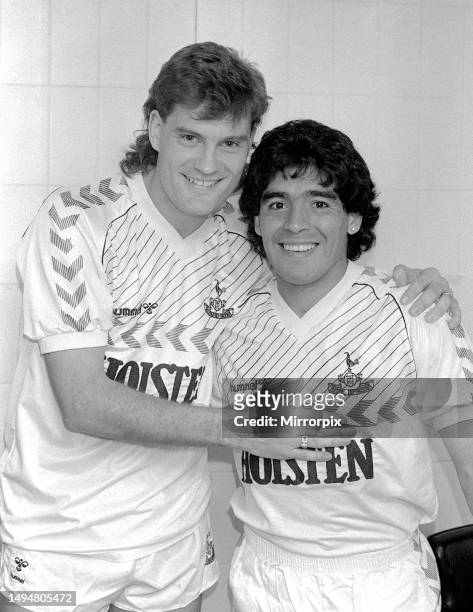 Footballers Glenn Hoddle , of Tottenham Hotspur FC, and Diego Maradona of Napoli, wearing Spurs kits sponsored by Holsten, at an Ossie Ardiles...