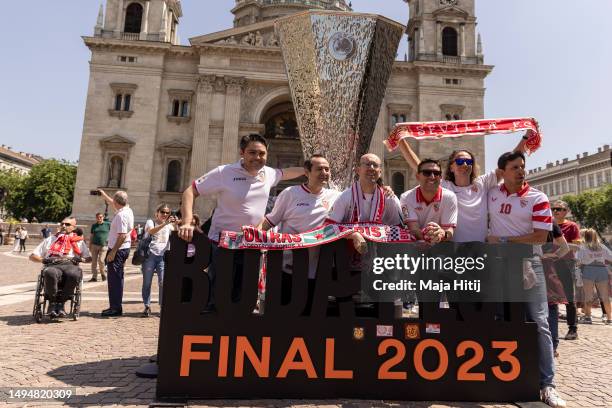 Fans celebrate near replica trophy near the Szent István-bazilika prior to the UEFA Europa League 2022/23 final match between Sevilla FC and AS Roma...