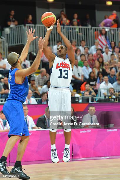 Chris Paul of the USA Mens Senior National team shoots against Tony Parker of France at the Olympic Park Basketball Arena during the London Olympic...
