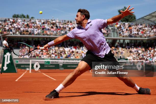 Stan Wawrinka of Switzerland plays a backhand against Thanasi Kokkinakis of Australia during the Men's Singles Second Round Match on Day Four of the...