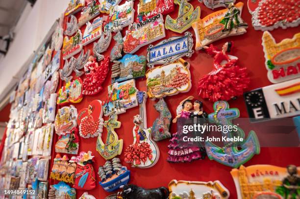 Souvenir fridge magnets are displayed for sale at a gift shop in the old town on April 18, 2023 in Malaga, Spain.