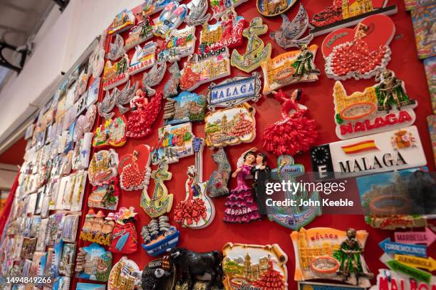 Souvenir fridge magnets are displayed for sale at a gift shop in the old town on April 18, 2023 in Malaga, Spain.