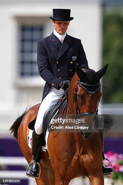 Nicolas Touzaint of France riding Hildago de L'ile competes in the Individual Dressage Equestrian event on Day 2 of the London 2012 Olympic Games at...