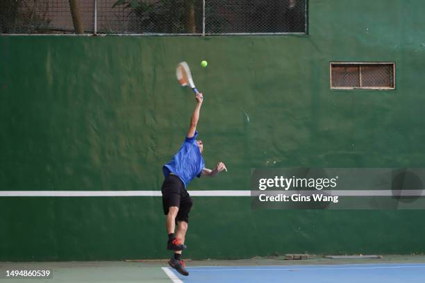 tennis player playing on tennis court. - tennis hitting stock pictures, royalty-free photos & images