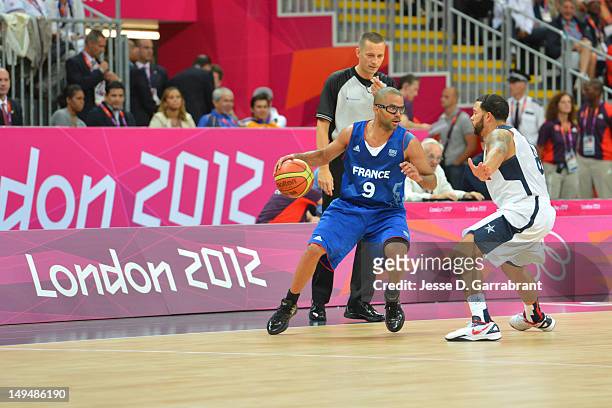 Tony Parker of France drives against Deron Williams of the USA Mens Senior National team at the Olympic Park Basketball Arena during the London...