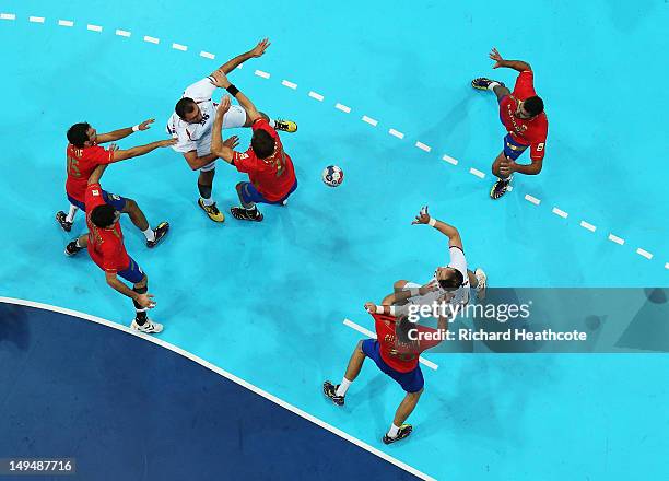 Ivan Stankovic of Serbia passes the ball to Alem Toskic of Serbia during the Men's Handball preliminaries group B match between Spain and Serbia on...