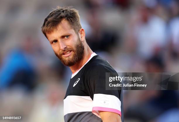 Corentin Moutet of France looks on against Andrey Rublev during the Men's Singles Second Round Match on Day Four of the 2023 French Open at Roland...