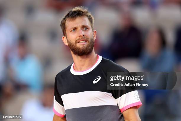 Corentin Moutet of France looks on against Andrey Rublev during the Men's Singles Second Round Match on Day Four of the 2023 French Open at Roland...