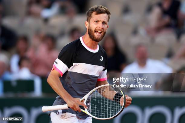 Corentin Moutet of France celebrates against Andrey Rublev during the Men's Singles Second Round Match on Day Four of the 2023 French Open at Roland...