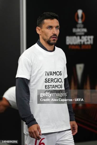 Jesus Navas of Sevilla FC warms up wearing a t-shirt in support of Sergio Rico of Paris Saint-Germain, after they suffered a head injury, prior to...