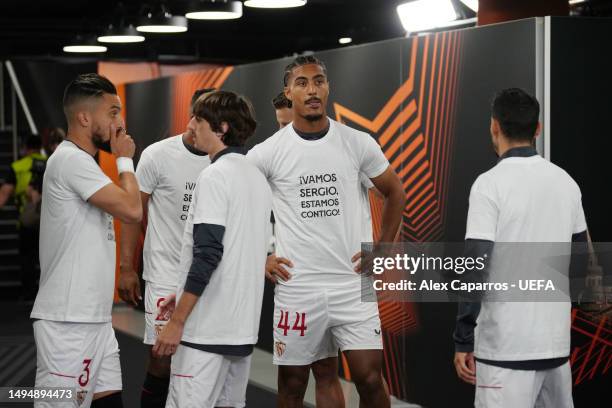 Loic Bade of Sevilla FC warms up wearing a t-shirt in support of Sergio Rico of Paris Saint-Germain, after they suffered a head injury, prior to the...