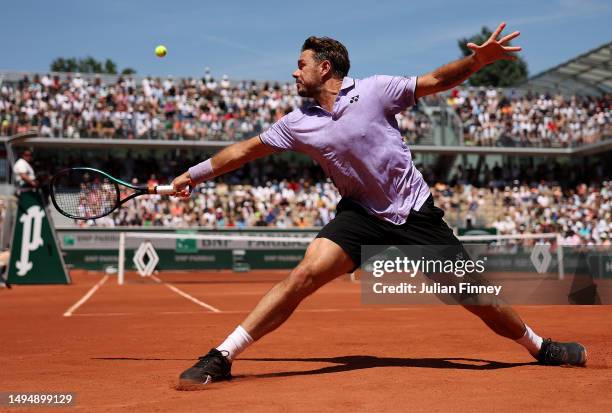 Stan Wawrinka of Switzerland plays a backhand against Thanasi Kokkinakis of Australia during the Men's Singles Second Round Match on Day Four of the...