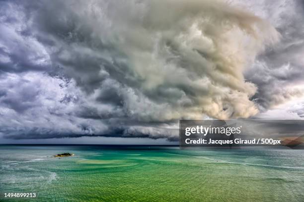 scenic view of sea against storm clouds,tanjung bungah,penang,malaysia - penang strand stock-fotos und bilder