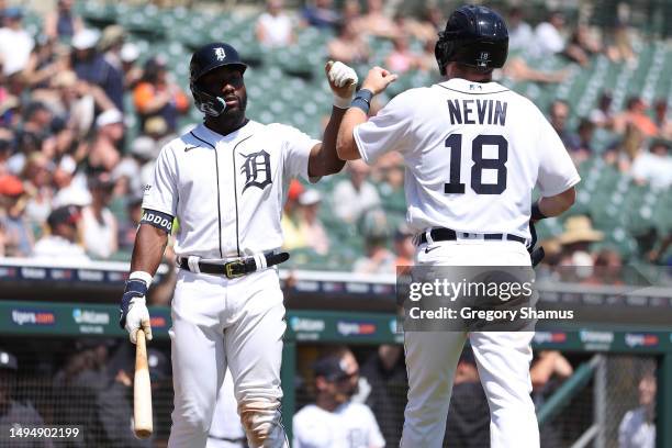 Tyler Nevin of the Detroit Tigers celebrates scoring a run in the sixth inning with Akil Baddoo while playing the Texas Rangers at Comerica Park on...