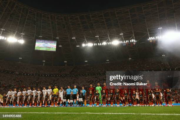 Sevilla FC and AS Roma players line up on the pitch prior to the UEFA Europa League 2022/23 final match between Sevilla FC and AS Roma at Puskas...