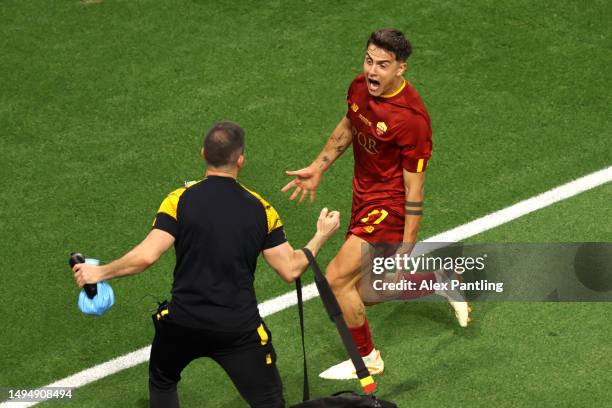 Paulo Dybala of AS Roma celebrates with a member of staff after scoring the team's first goal during the UEFA Europa League 2022/23 final match...