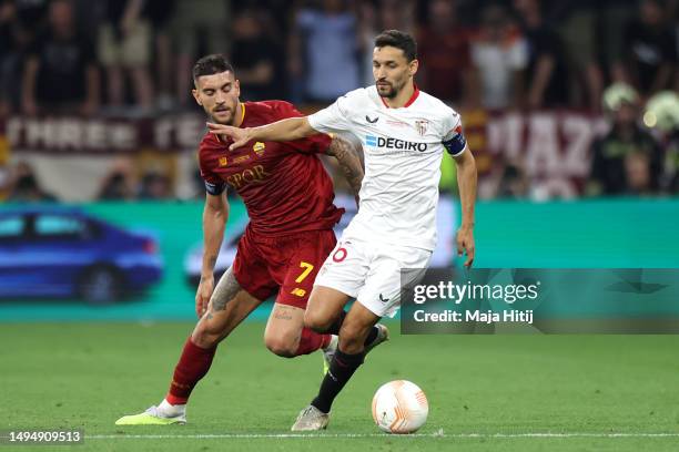 Jesus Navas of Sevilla FC runs with the ball whilst under pressure from Lorenzo Pellegrini of AS Roma during the UEFA Europa League 2022/23 final...