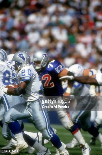 Running Back Barry Sanders of the Detroit Lions has a short gain in the game between the Detroit Lions vs the New England Patriots at Foxboro Stadium...