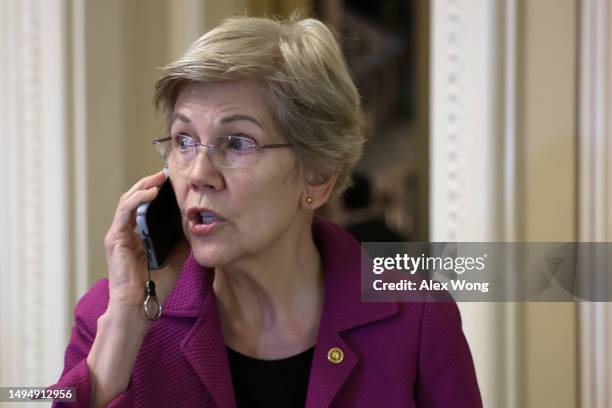 Sen. Elizabeth Warren talks on her phone prior to a weekly Democratic policy luncheon at the U.S. Capitol on May 31, 2023 in Washington, DC. Senate...